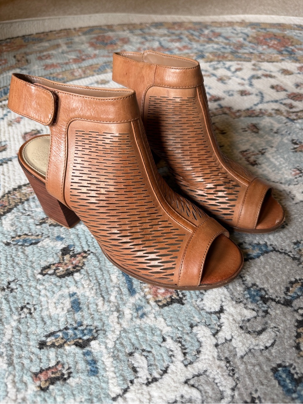 Size 8 Vince Camuto Lavette perforated peep-toe booties (tan/cognac leather).